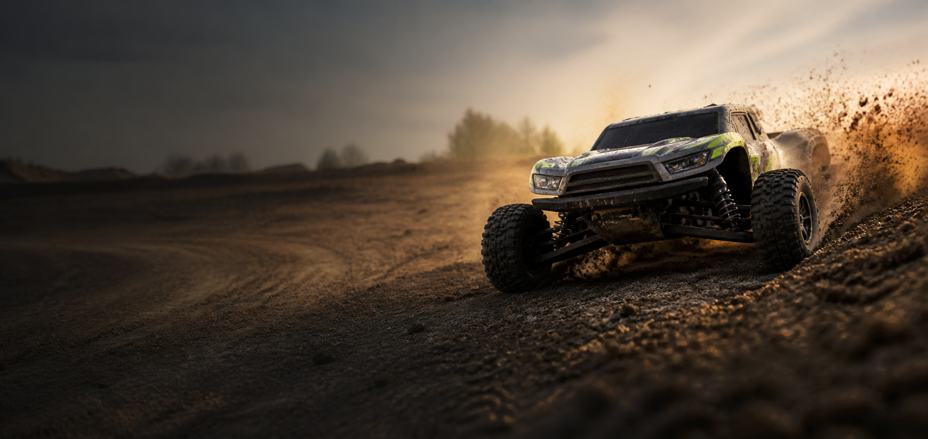 Hobby-grade RC short-course truck throwing dirt at sunset